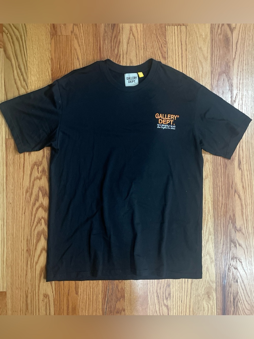 Gallery Dept Men's Black Logo Tee with Orange Accent graphic print
